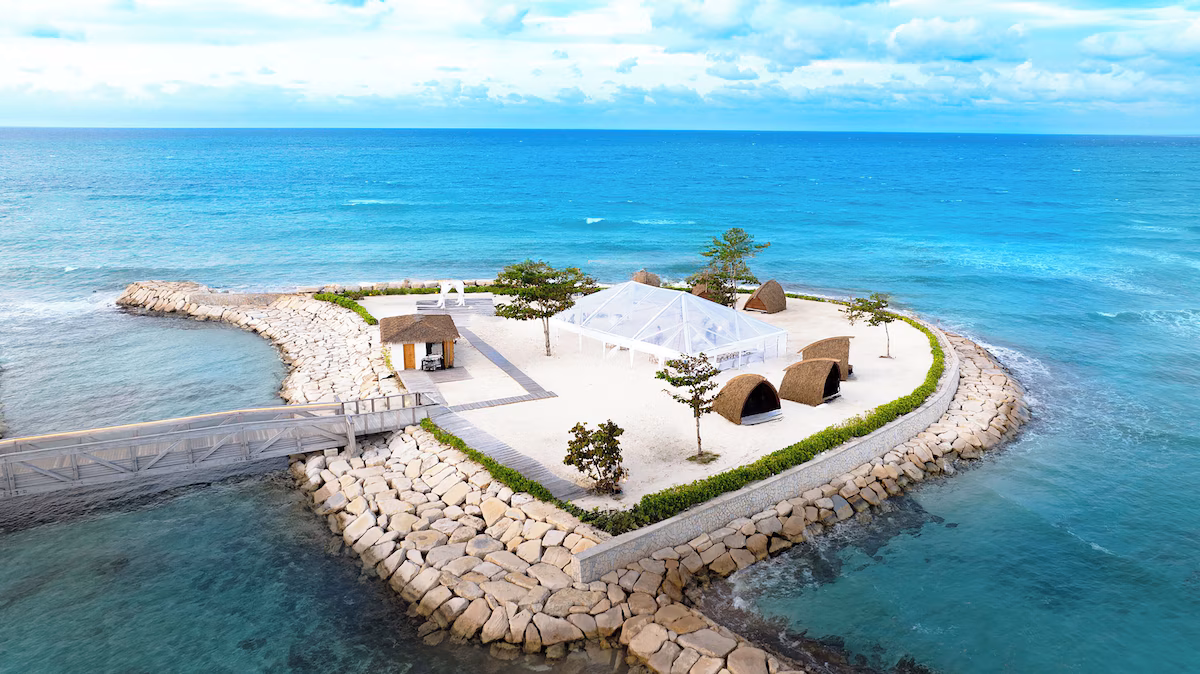 Dream Island from the air, with the marquee, the cabanas and the causeway out to it